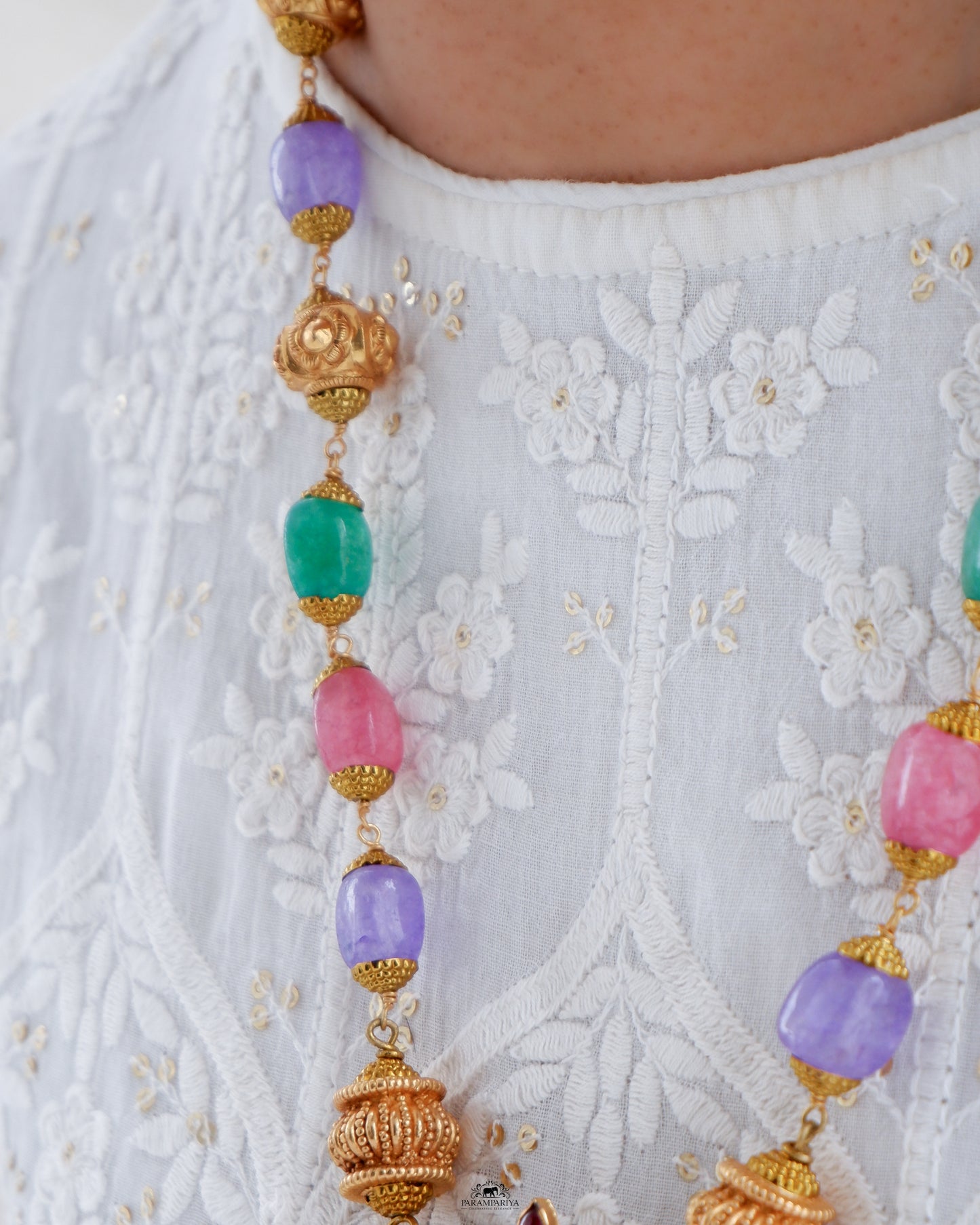 This Vish Necklace is expertly crafted from 92.5 pure silver with antique gold micron plating and adorned with semi-precious beads. It features intricately carved depictions of Lord Vishnu and Goddess Lakshmi, making it a bold statement piece.