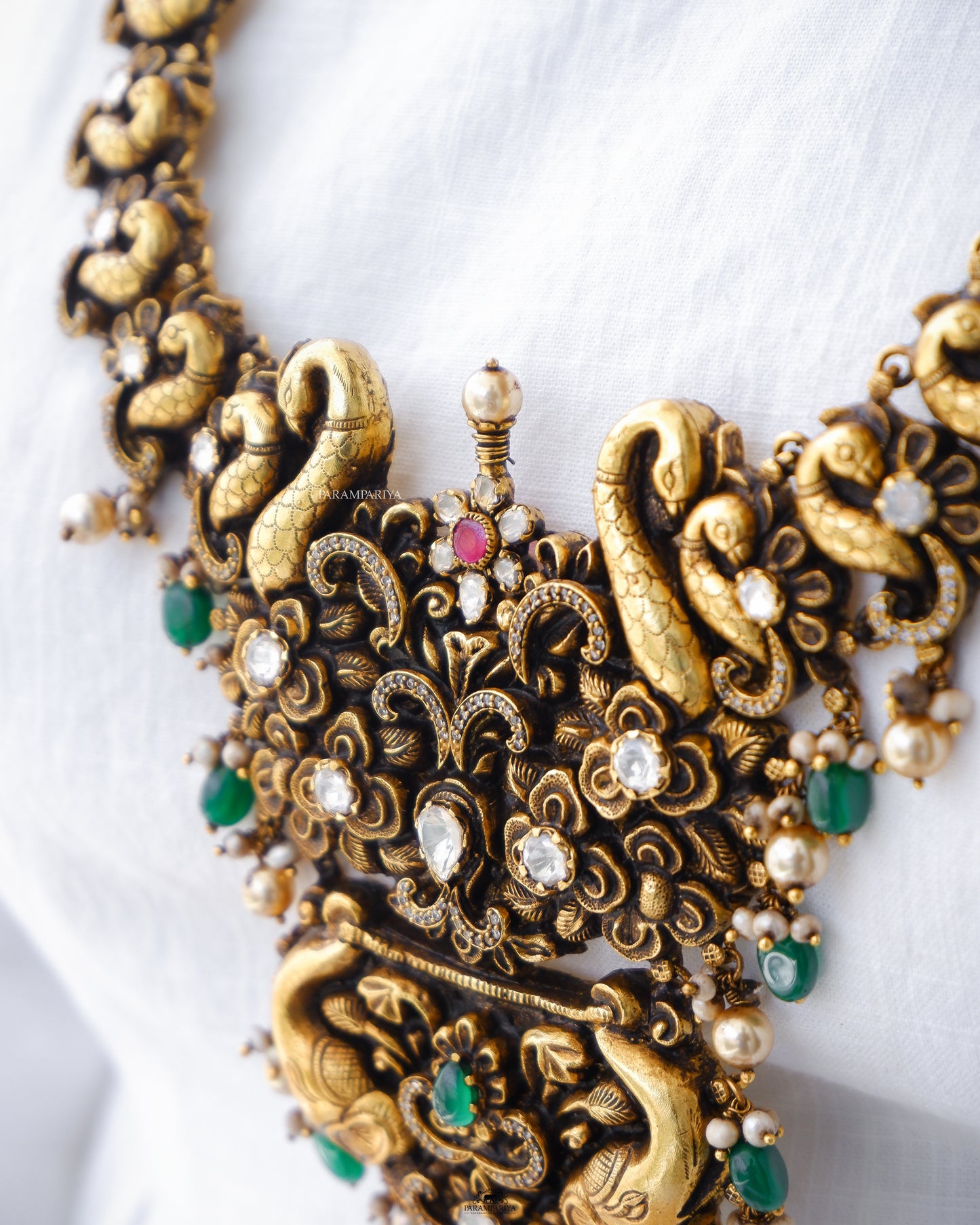 Grandeur 92.5 pure silver gold micron plated nagas necklace adorning moissanite and zircon stones with pearls, a definite antique pick for your special occasions.