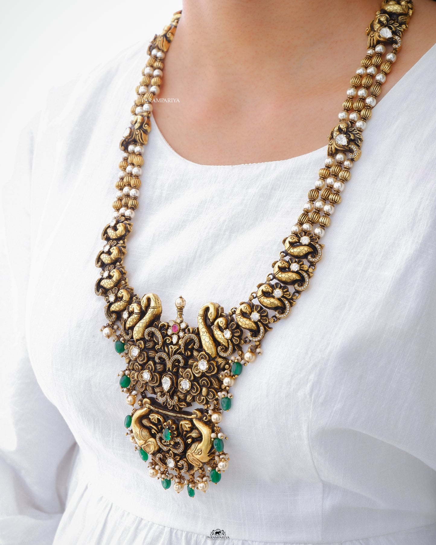 Grandeur 92.5 pure silver gold micron plated nagas necklace adorning moissanite and zircon stones with pearls, a definite antique pick for your special occasions.