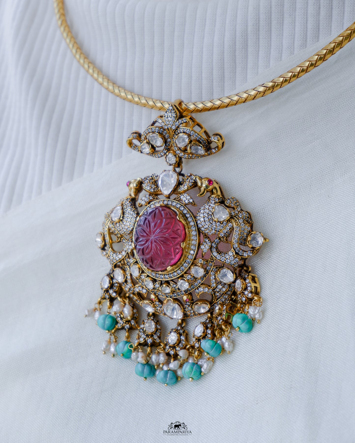 Dazzling hasli necklace with moissanite pendant adorned with turquoise beads made of 92.5 pure silver with micron gold plating is a perfect accessory for cocktail or formal occasions. A timeless piece that adds a touch of elegant sophistication to any ensemble.