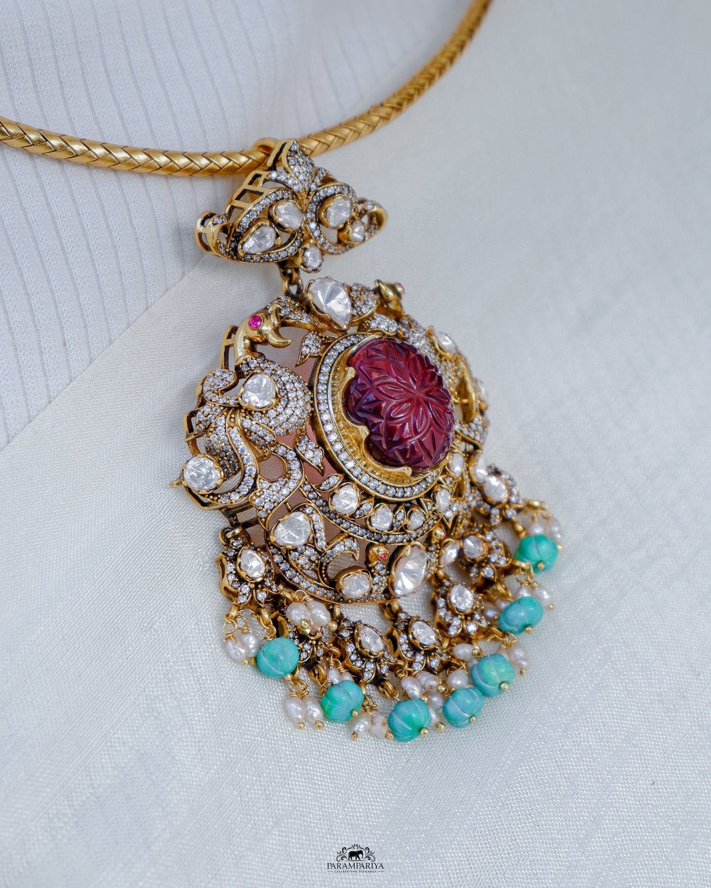 Dazzling hasli necklace with moissanite pendant adorned with turquoise beads made of 92.5 pure silver with micron gold plating is a perfect accessory for cocktail or formal occasions. A timeless piece that adds a touch of elegant sophistication to any ensemble.