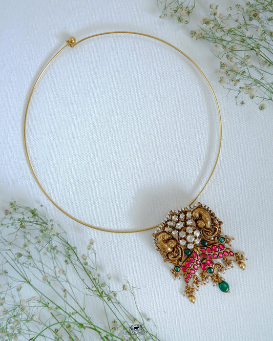 Simple hasli necklace with handcrafted temple nakshi pendant with moissanite, kundan stones for a minimal look.