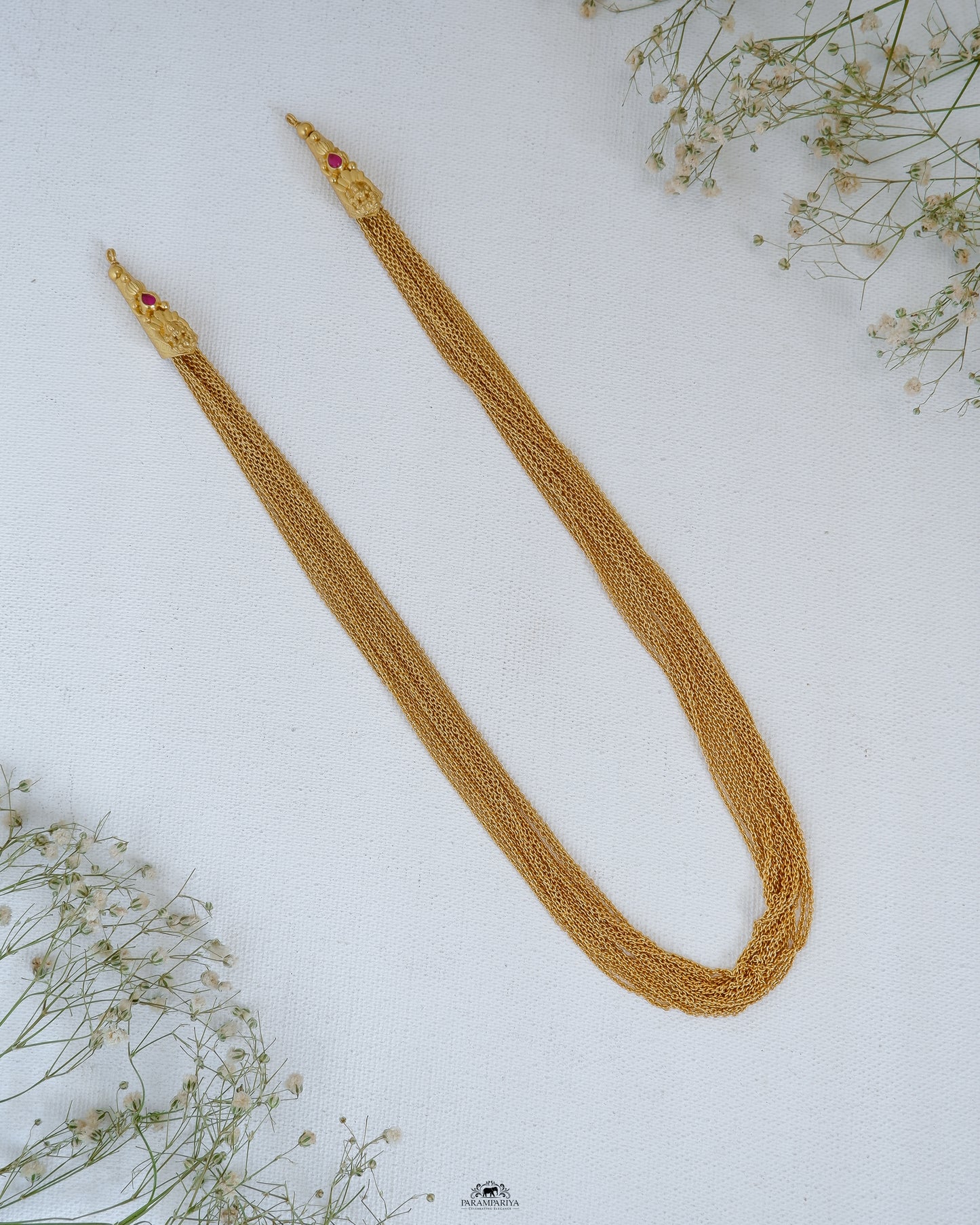 A chain of pure silver intricately plated with micron gold, versatile enough to hold any pendant or be donned alone as an exquisite necklace.