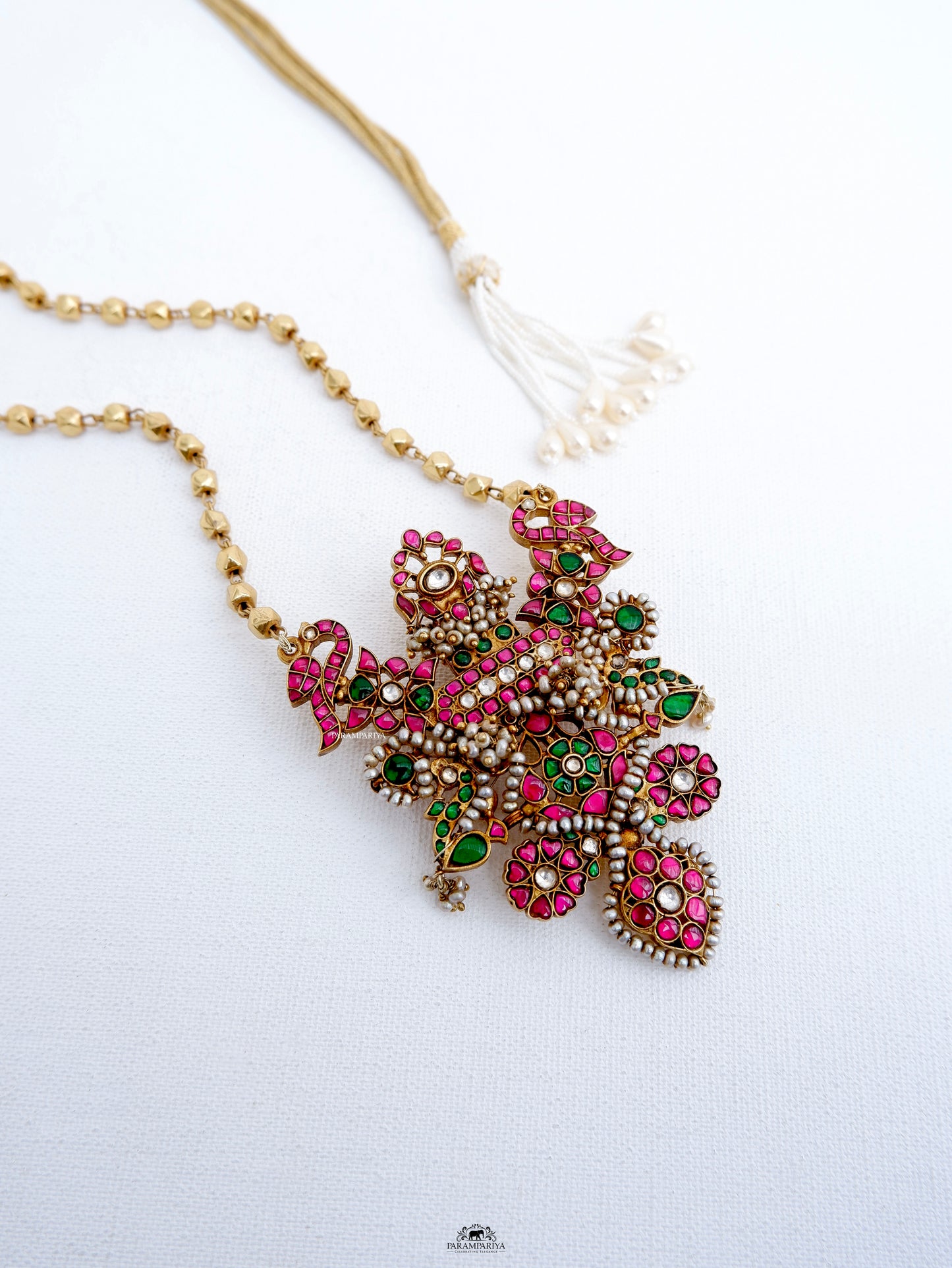 This Mithra Necklace features a pure silver micron gold plated kundan pendant adorned with gold beads, maintaining a vintage and unique appeal.