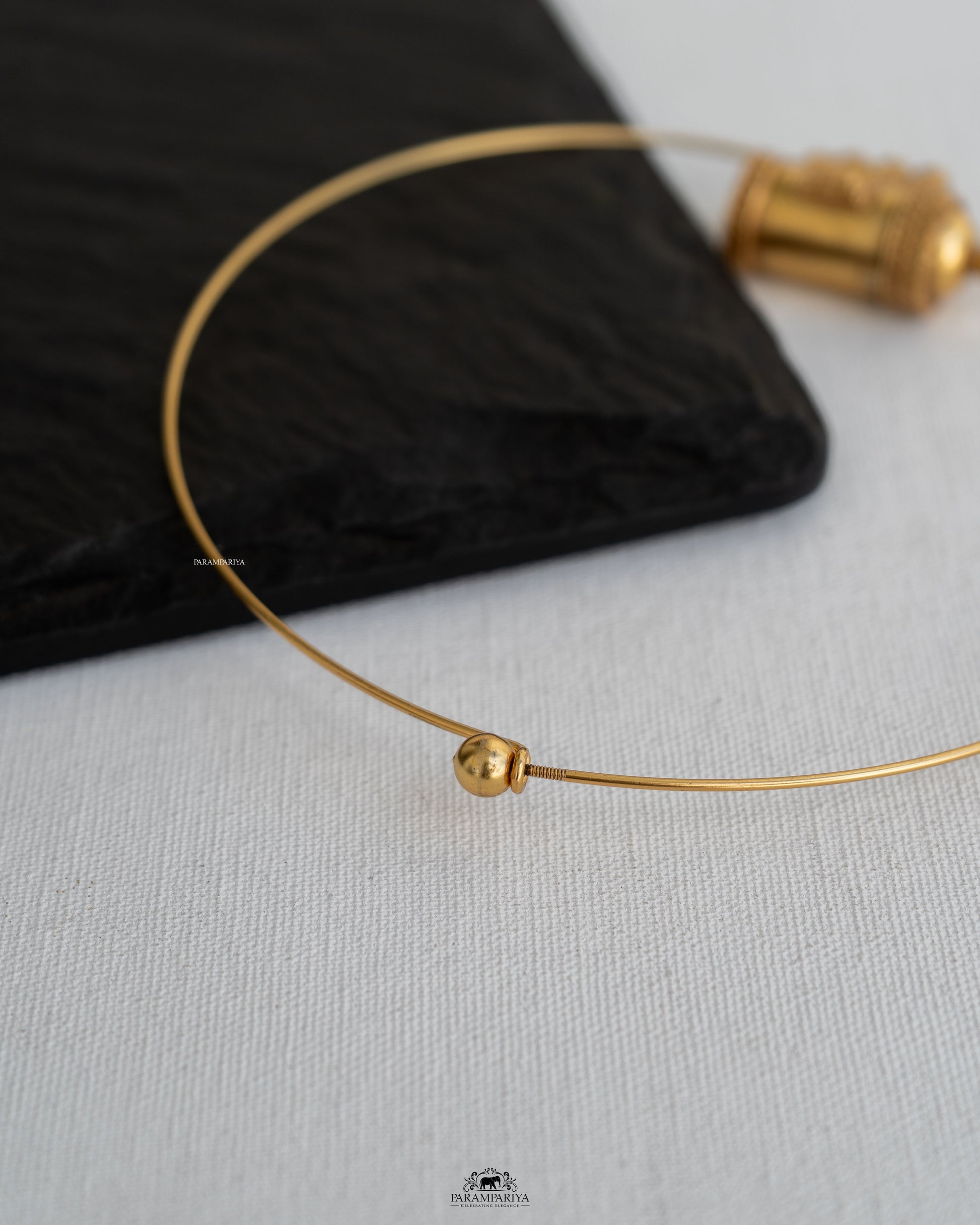 Start a conversation with this unique statement piece, a 92.5 pure silver micron gold-plated hasli necklace.