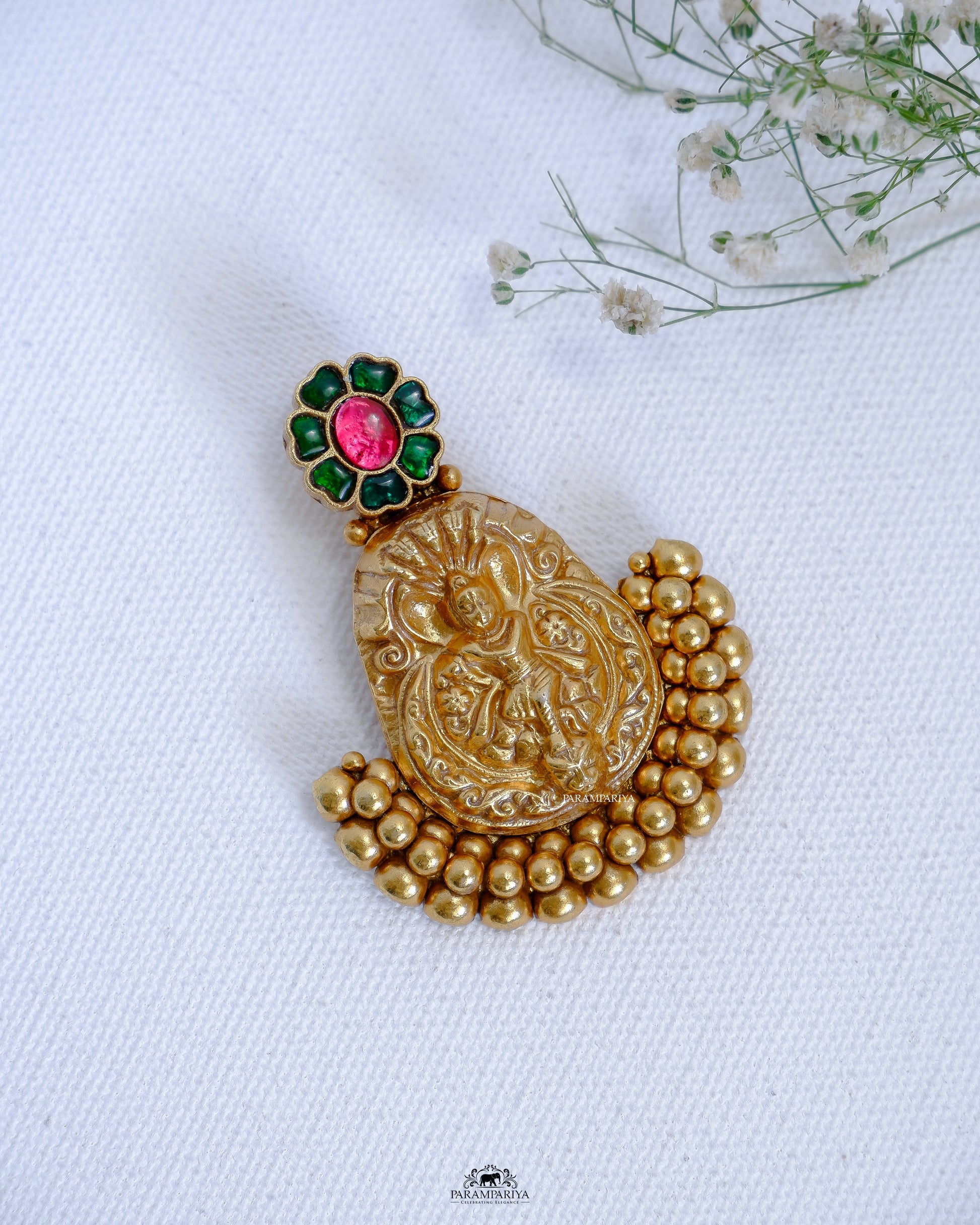  This pendant features an intricate vintage-style design in gold micron-plated pure silver with kundan stones for a timeless, luxurious look. The precise detailing ensures long-lasting quality and beauty.