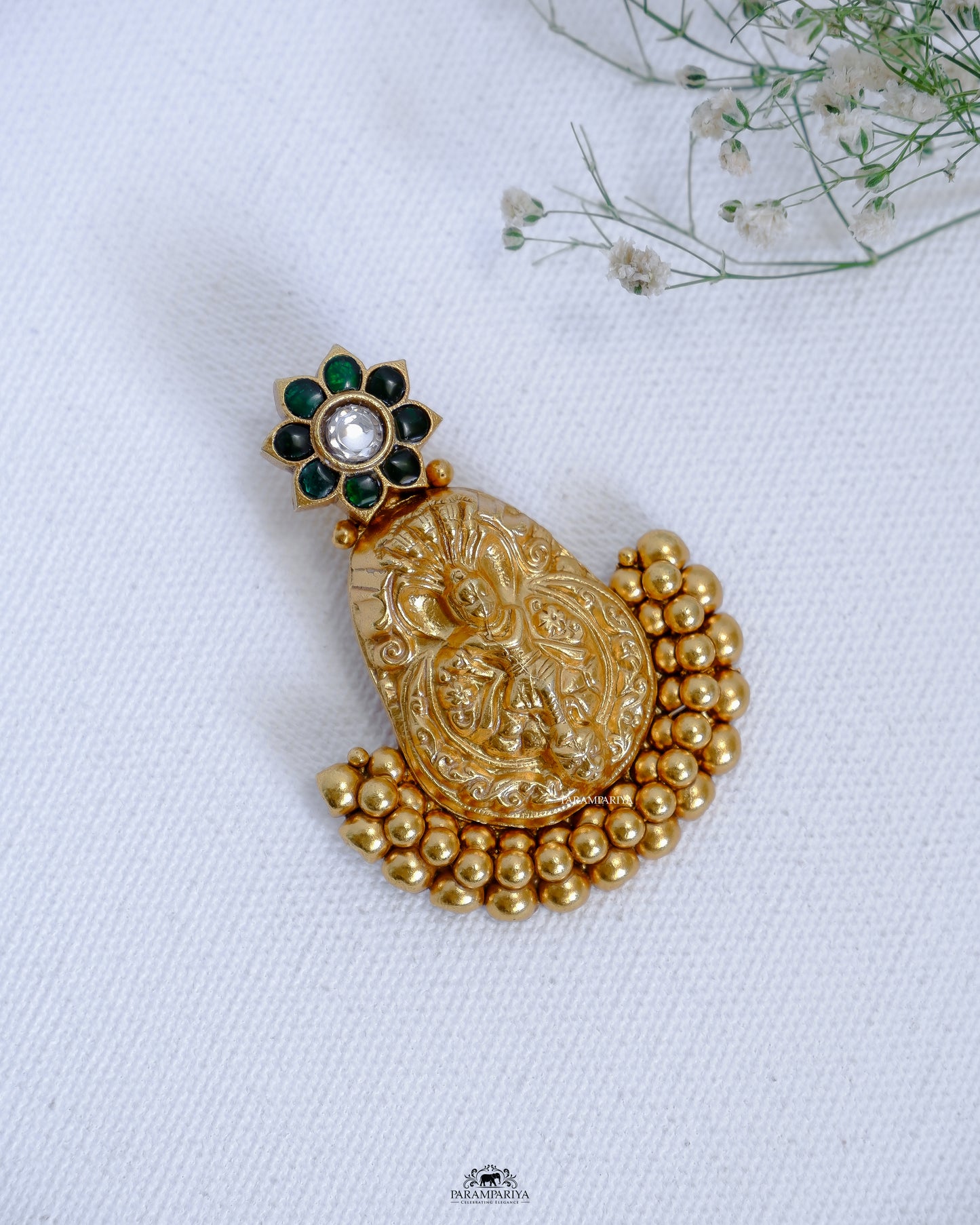  This pendant features an intricate vintage-style design in gold micron-plated pure silver with kundan stones for a timeless, luxurious look. The precise detailing ensures long-lasting quality and beauty.