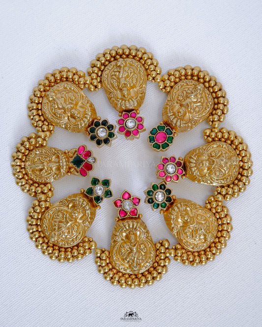  This pendant features an intricate vintage-style design in gold micron-plated pure silver with kundan stones for a timeless, luxurious look. The precise detailing ensures long-lasting quality and beauty.