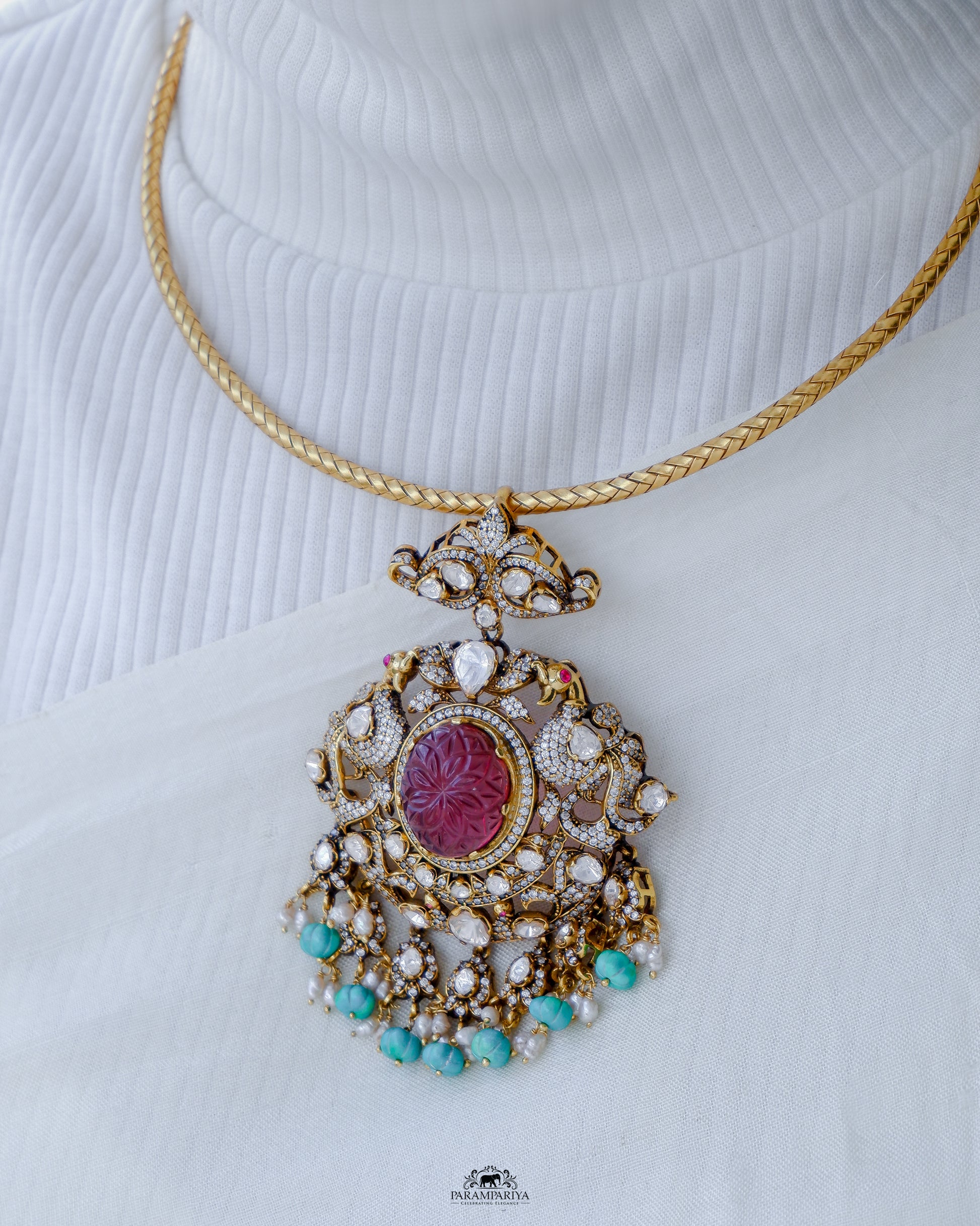 Dazzling hasli necklace with moissanite pendant adorned with turquoise beads made of 92.5 pure silver with micron gold plating is a perfect accessory for cocktail or formal occasions. A timeless piece that adds a touch of elegant sophistication to any ensemble.