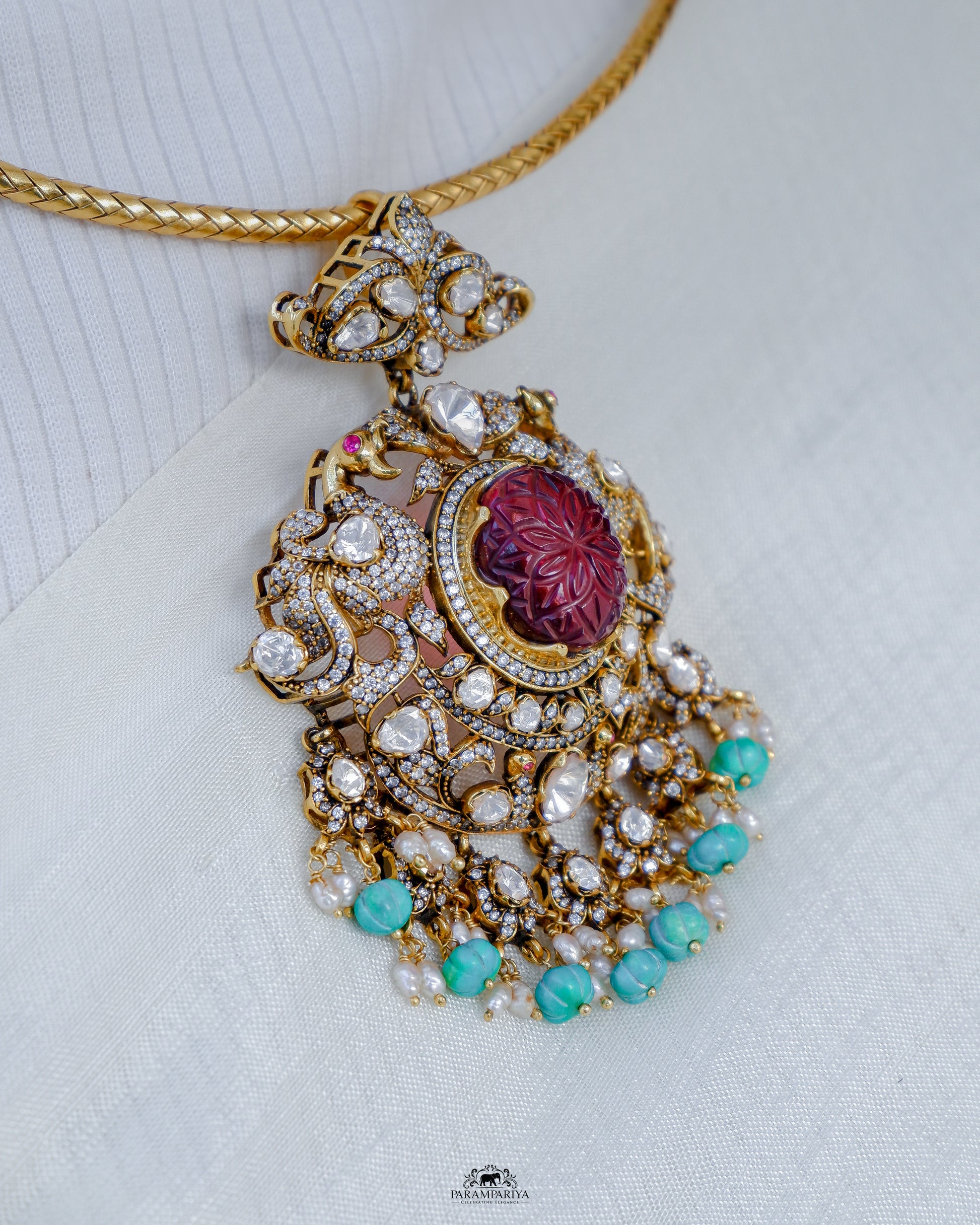 Dazzling hasli necklace with moissanite pendant adorned with turquoise beads made of 92.5 pure silver with micron gold plating is a perfect accessory for cocktail or formal occasions. A timeless piece that adds a touch of elegant sophistication to any ensemble.