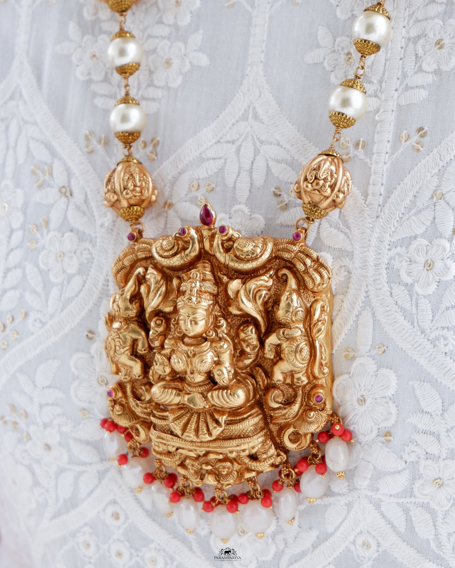 This exquisite silver necklace, adorned with intricate goddess Lakshmi detailing and gold micron plating, is a unique piece of temple jewellery.