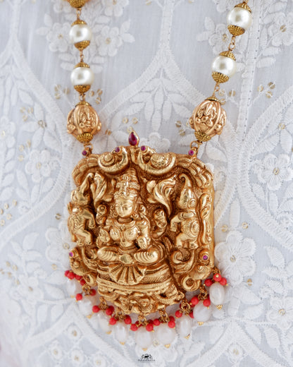 This exquisite silver necklace, adorned with intricate goddess Lakshmi detailing and gold micron plating, is a unique piece of temple jewellery.