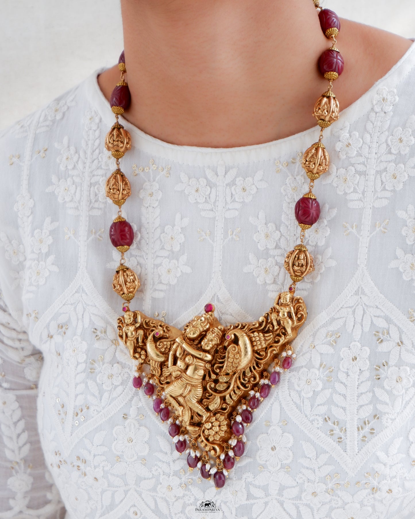 A captivating unisex necklace featuring Krishna Radha in pure silver and antique gold micron plating, this piece is part of our revered temple jewellery collection.