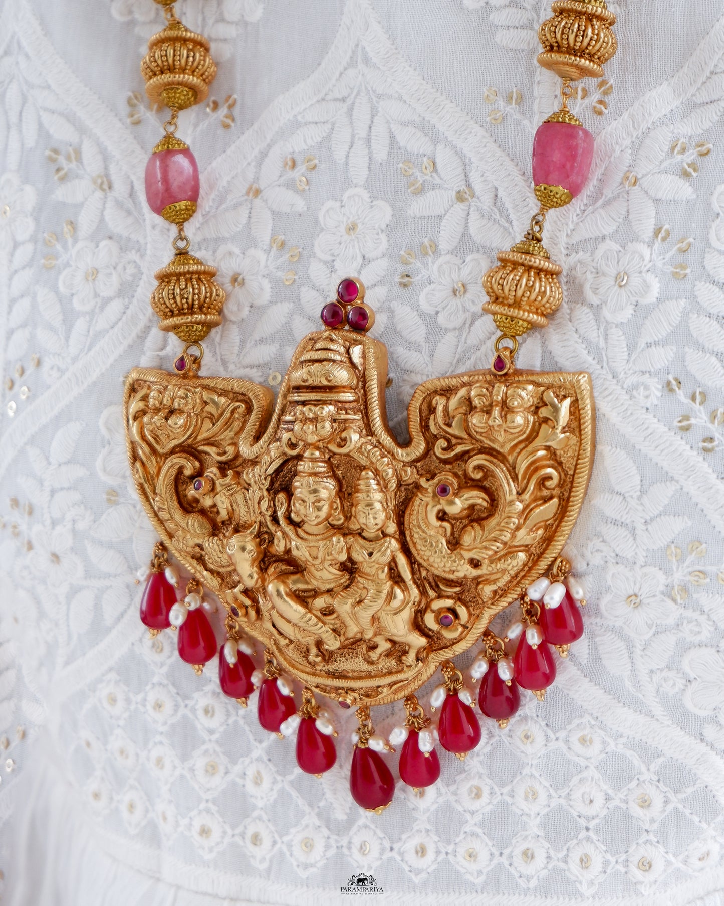 Intricately-crafted temple antique necklace featuring a depiction of Shiv and Paravathi on pure silver with antique gold micron plating, a perfect unisex necklace.