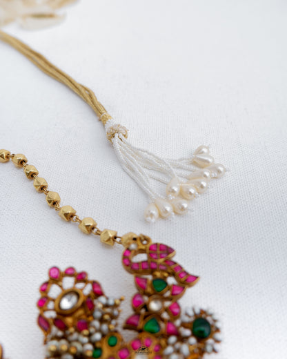 This Mithra Necklace features a pure silver micron gold plated kundan pendant adorned with gold beads, maintaining a vintage and unique appeal.
