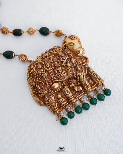 
Expertly handcrafted with pure silver and adorned with micron gold plating and semi-precious beads, this temple necklace showcases a stunning representation of Kamadhenu, creating a truly exquisite work of art.
