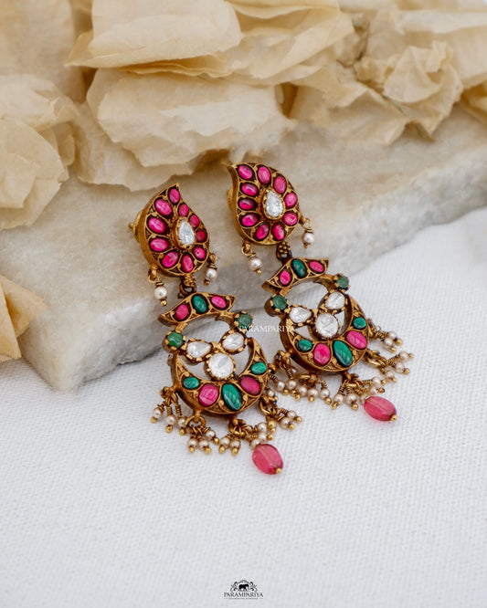Experience the exquisite craftsmanship of our Kannu&nbsp;Earrings, featuring kundan detailing and moissanite stones set in 92.5 pure silver with a micron gold plating. These earrings are a perfect addition to any ethnic ensemble.