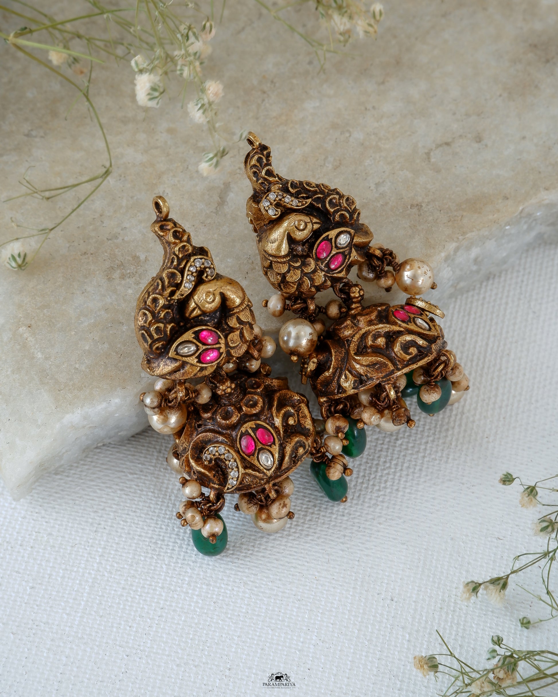 Mini jhumkas for an adorable look!!
Pure silver gold micron plated nakshi jhumkas with kundan and zircon stones.