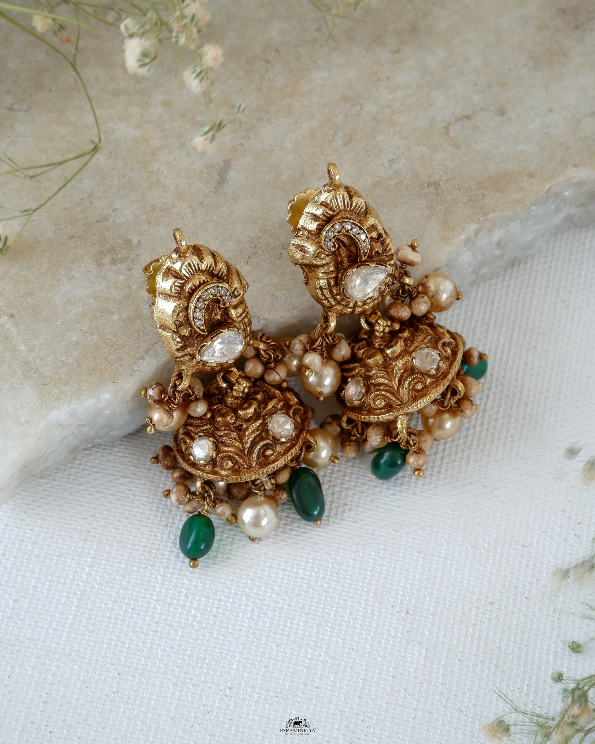 Mini jhumkas for an adorable look!!
Pure silver gold micron plated nakshi jhumkas with kundan and moissainite stones.