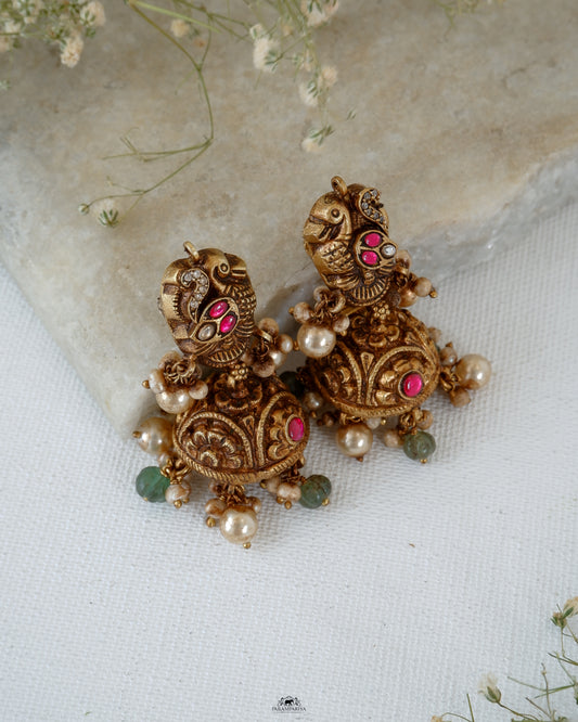 Mini jhumkas for an adorable look!!
Pure silver gold micron plated nakshi jhumkas with kundan and zircon stones.
