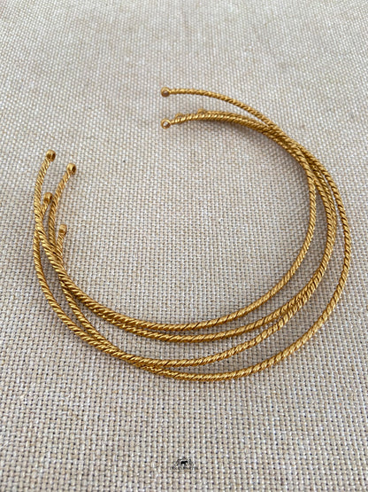 A simple gold micron plated pure silver hasli with a twisted texture to mix and match with any of your gold or silver pendants for a minimal look.

 