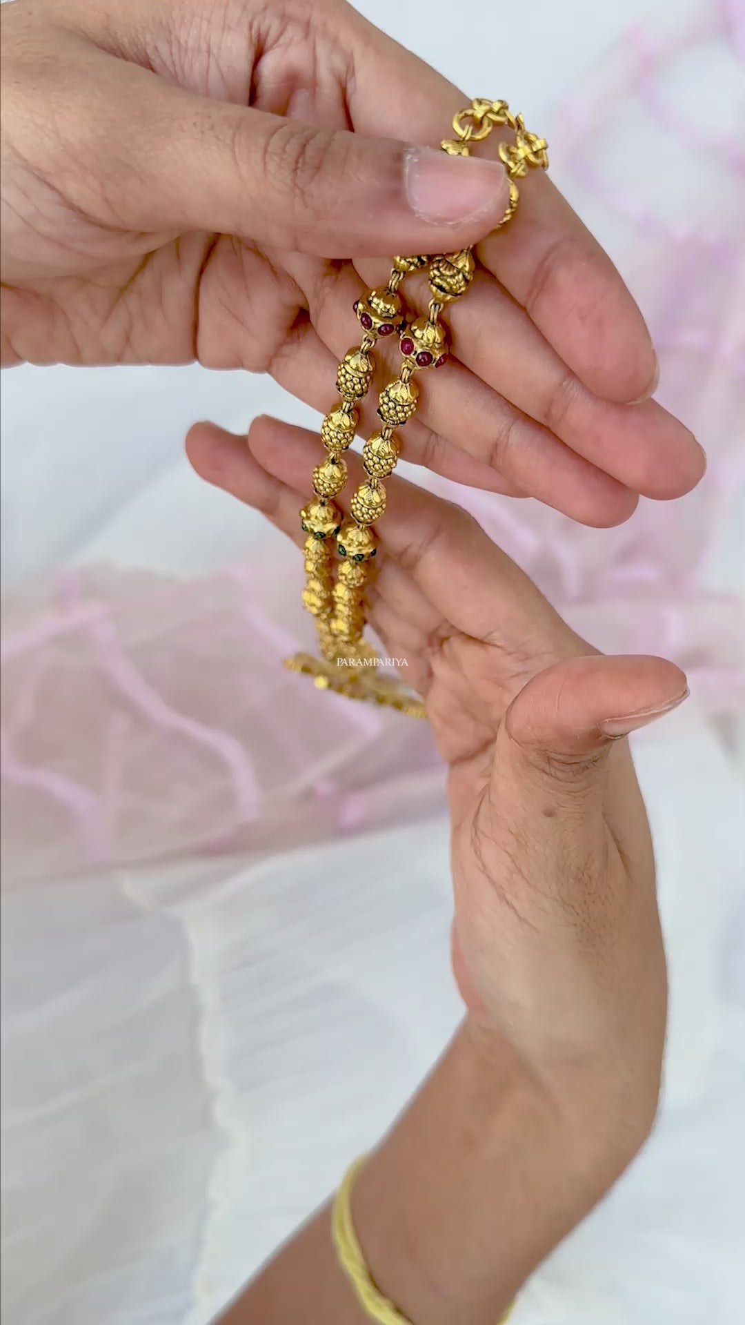 This Nithra Necklace features a pure silver micron gold plated kundan pendant adorned with gold beads, maintaining a vintage and unique appeal.