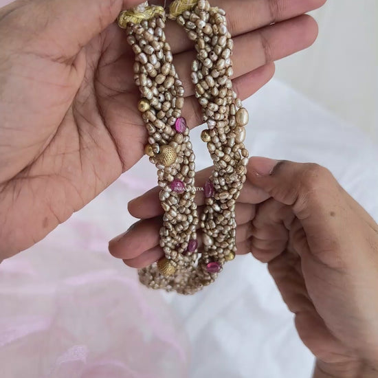 This one-of-a-kind necklace featuring a classically-styled bunch of antique fresh water pearls for a timelessly elegant look.