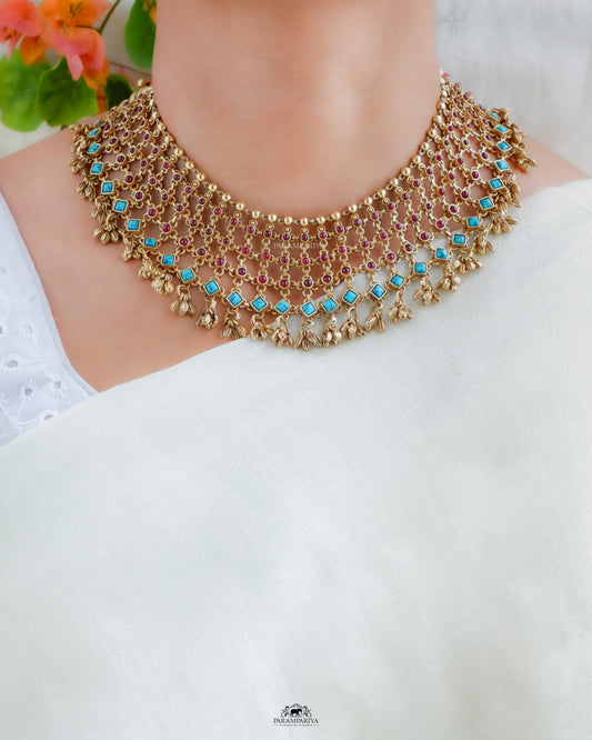Pure silver micron gold plated necklace with carefully crafted intricate link patterns with semi precious green or pink kemp stones with a touch of turquoise or coral charm.